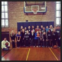 Basketball players participating in special olympics basketball clinic